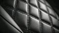 Detailed view of black leather upholstery with diamond pattern stitching highlighting premium texture and craftsmanship in vehicle Royalty Free Stock Photo
