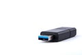 Detailed view of black USB flash drive with silver blue connector. On white background with space for your text