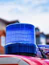 Blue rotating beacon on the roof of a red fire truck Royalty Free Stock Photo