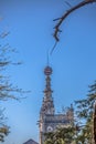 Detailed view of BuÃÂ§aco palace tower in the middle of trees