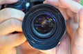 The detailed view into the camera lens of photographer taking pi Royalty Free Stock Photo