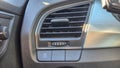 Detailed view of a car interior showing the climate control air vent and controls, highlighting modern design and functi Royalty Free Stock Photo
