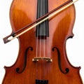 Detailed View of a Cello with Bow on White Background in Studio Light Royalty Free Stock Photo