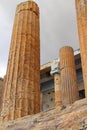 Detailed view of columns of the Parthenon temple in Acropolis against cloudy sky. Ancient ruins, antique architecture Royalty Free Stock Photo