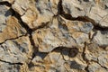 A detailed view of a crack in a rock, showcasing its texture and structure, Crisp and dry texture Royalty Free Stock Photo
