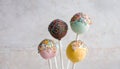 Detailed view of delicious cake pops decorated with frosting chocolate and sprinkles Royalty Free Stock Photo