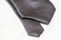 Detailed view on ends of gray necktie