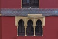 Detailed view of the exterior facade of a Moorish-style building, Arabic architecture with decorative elements, arabic multifoil