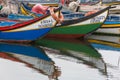 Detailed view at the front moliceiro boat, a traditional boat used to collect seaweed, reflection on water, typically boat used on