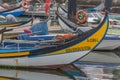 Detailed view at the front moliceiro boat, a traditional boat used to collect seaweed, reflection on water, typically boat used on