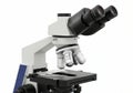 Modern laboratory microscope with multiple lenses and stage, isolated on white background Royalty Free Stock Photo