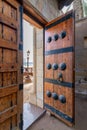 Detailed view of a intricate Mamluk style door, including dekoratif metalwork and timeworn handles