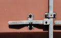 Detailed view of the locking system on a standard shipping container. Royalty Free Stock Photo