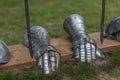 Detailed view of medieval prop, knight metal gloves perched on wooden decorating beam