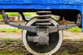 Detailed view of metal wheel of old tram. Steel wheel tram. old vintage tram wheel with shadows stay on rail Royalty Free Stock Photo