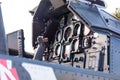 Detailed view of military helicopter cockpit with control stick and dashboard with instruments