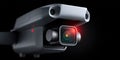 Detailed view of a modern drone camera with LED indicator and advanced lens design in a dark setting Royalty Free Stock Photo
