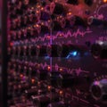 Close-up of a vintage audio mixer with glowing lights and sound wave display Royalty Free Stock Photo