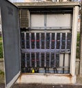 Outdoor industrial telecommunication distribution cabinet with complex wiring, copper cables and terminal blocks Royalty Free Stock Photo