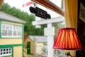 Detailed view of an ornate table lamp seen in a dining car at a railway station. Royalty Free Stock Photo