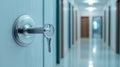 Detailed view of a prison cell door lock with a key inserted, emphasizing security and confinement in a blurred corridor Royalty Free Stock Photo