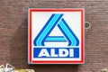 Logo and name of supermarket chain Aldi on a brick wall. Royalty Free Stock Photo