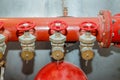 Detailed view of red old fire pump pipe with small valve stopcock Royalty Free Stock Photo