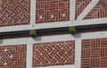 Detailed view of a rural half-timbered house in the old coun-try near Hamburg. Red bricks, white joints and wooden beams, the Royalty Free Stock Photo