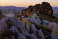 Detailed view of shaped sandstone rocks against sunset sky. Typical geologic formations of Cappadocia Royalty Free Stock Photo