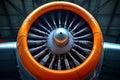 Close up view of a powerful aircraft engine propeller with vibrant orange cowling and intricate metal blades Royalty Free Stock Photo