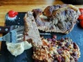 Detailed view of a sliced portion beef, mashed potatoes and beans rice, grilled beef steak with great aspect as background