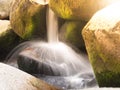 Detailed view of small river cascade on a rocky mountain river. Blurred silk water by long exposure shot Royalty Free Stock Photo