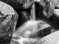 Detailed view of small river cascade on a rocky mountain river. Blurred silk water by long exposure shot Royalty Free Stock Photo