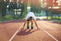 Detailed view of a sprinter getting ready to start. Selective focus. Royalty Free Stock Photo