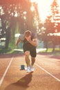 Detailed view of a sprinter getting ready to start. Selective focus. Royalty Free Stock Photo