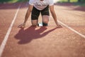 Detailed view of a sprinter getting ready to start. Selective focus. Royalty Free Stock Photo