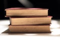 Detailed view of stack of three old books