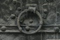 Very old black church door with a ring knocker