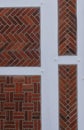 Detailed view of a wall from a rural half-timbered house in the old country near Hamburg, Red bricks, white joints and wooden Royalty Free Stock Photo