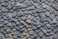 Detailed view of wall texture randomly lined with slate panels, typical and traditional shale stone material, used as external Royalty Free Stock Photo