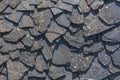 Detailed view of wall texture randomly lined with slate panels, typical and traditional shale stone material Royalty Free Stock Photo