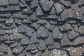 Detailed view of wall texture randomly lined with slate panels, typical and traditional shale stone material, used as external Royalty Free Stock Photo