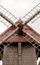 view of a windmill with its large drive shaft and the windmill vane