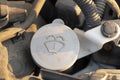 Close-up of a car\'s windshield washer fluid cap in an engine bay, showcasing automotive details Royalty Free Stock Photo