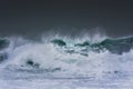 Detailed winter storm wave breaking and splashing on shore Royalty Free Stock Photo