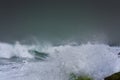 Detailed winter storm wave breaking and splashing on shore Royalty Free Stock Photo