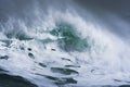 Detailed winter storm wave breaking and splashing on shore Royalty Free Stock Photo