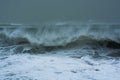 Detailed winter storm wave breaking and splashing on shore Royalty Free Stock Photo