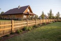 detailed wooden fence surrounding french country home