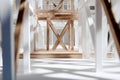Architectural model of intricate wooden framework highlighting cross beams and vertical supports in a brightly lit modern Royalty Free Stock Photo